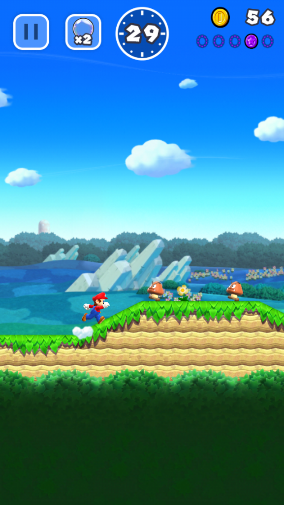 Mario running toward goombas in super mario run